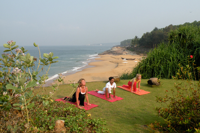 Permalink to Yoga at the Olympics? People doing yoga by the sea in Kerala, India
