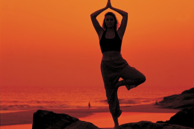 Yoga beach sunset in India - Neals Yard Holidays