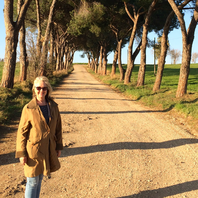 typical Roman tree lined path with walker in sunshine