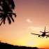 Flying on a budget: An airplane flying into the sunset © Happy Stock Photo