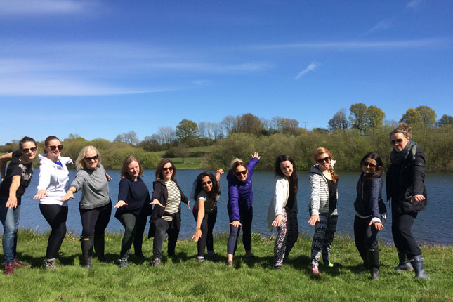 Happy group of people outdoors at AdventureYogi Retreat Sussex UK