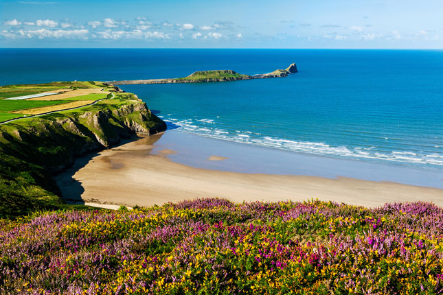 Where to go on holiday in September, view of beach and sea in Gower