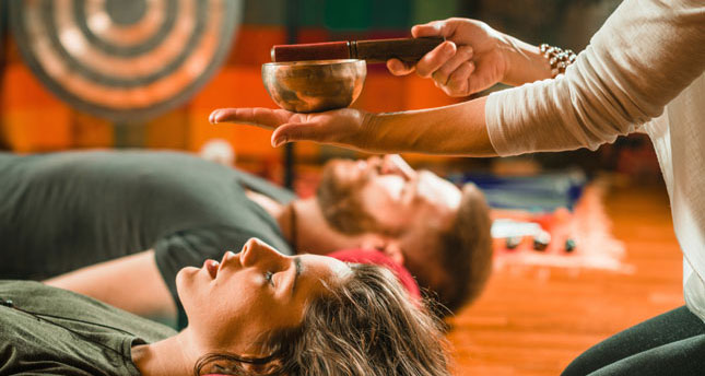 people lying down for gong sound bath