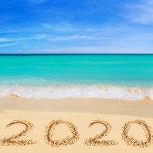 2020 written in sand on sunny beach holiday © Adisa